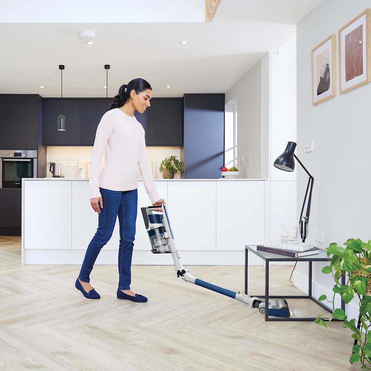 Shark PowerPro IZ380UK bending to reach under furniture